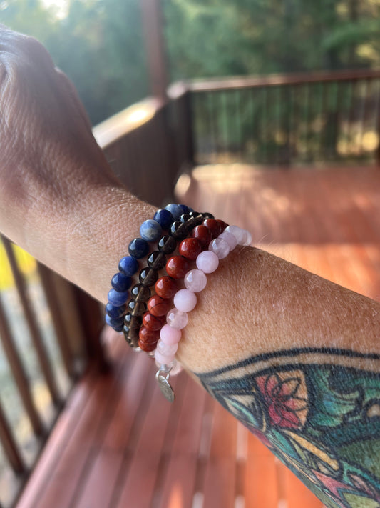 Scorpio stack crystal bracelet featuring rose, quartz, smoky quartz, red Jasper, and sodalite 