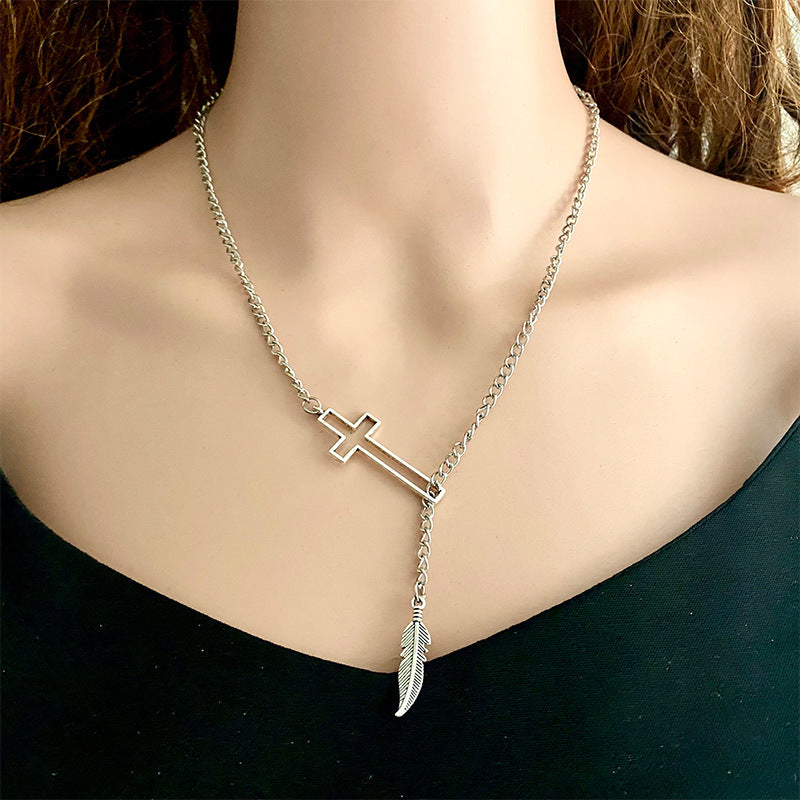 Cross chain necklace with feather