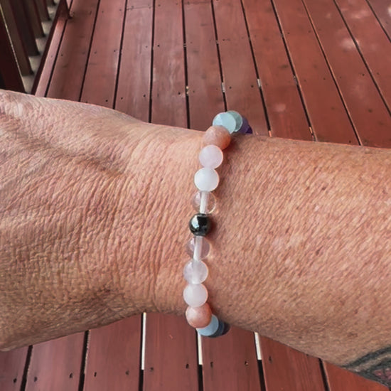 Bracelet with hematite, clear quartz, moonstone, rose quartz, sunstone, rainbow fluorite, aquamarine, amethyst, black tourmaline, turquoise, onyx, garnet, and delicate filigree details