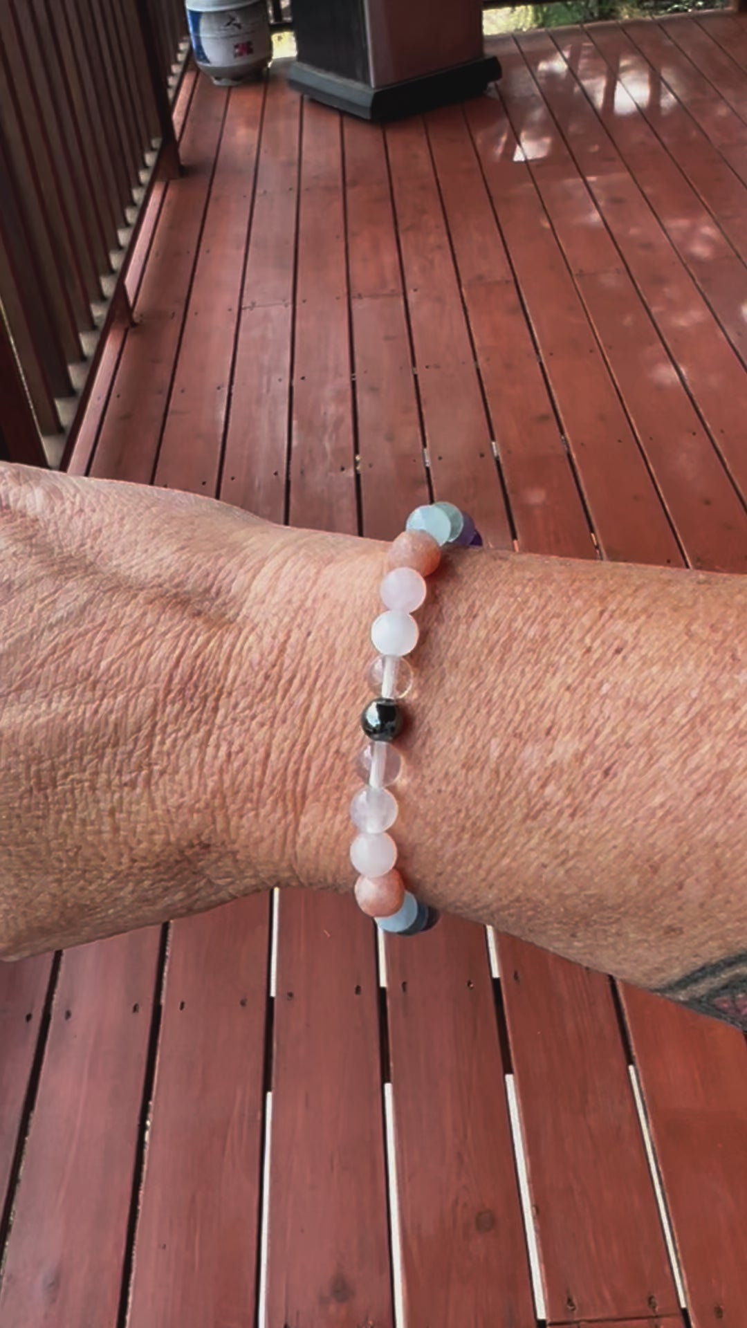 Bracelet with hematite, clear quartz, moonstone, rose quartz, sunstone, rainbow fluorite, aquamarine, amethyst, black tourmaline, turquoise, onyx, garnet, and delicate filigree details