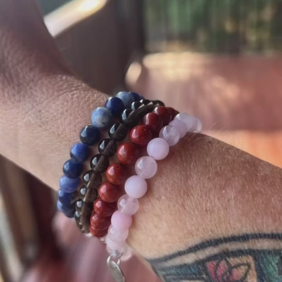 Scorpio stack crystal bracelet featuring rose, quartz, smoky quartz, red Jasper, and sodalite 